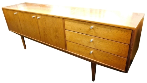 A 1950/60's Indian rosewood sideboard, in Scandinavian style, three doors and three drawers, each with turned cylindrical aluminium handles on square tapering legs, 74cm high, 205cm wide.
