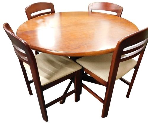 A Danish design rosewood extending dining table, the circular top on a shaped column and base, the top 72 high, the top 116cm by 215cm extended (73cm closed). CITES license no. 612358/01