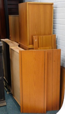 A quantity of Ladderax furniture, comprising of four ebonised metal supports, various teak cabinets, shelves, etc.