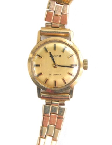 A ladies 9ct gold Accurist wristwatch, the 1cm dia. dial with baton numerals with a textured bracelet marked 375, 16.1g all in.