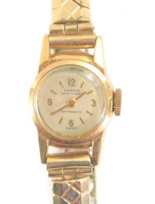 A ladies Veroni cocktail watch, the 1cm dia. dial with Arabic and baton numerals, marked 18k 0.750, with plated elasticated bracelet, 13g all in.