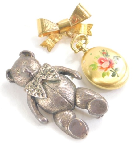 An Elizabeth II silver Period Jewellery Manufacturing brooch, formed as a Teddy bear with plain pin back and a rolled gold brooch watch, 5cm high. (2)