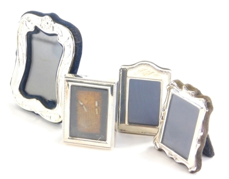 Various Elizabeth II silver miniature photograph frames, one marked 925 with plain velvet finish easel back, 8cm high and three others. (4)