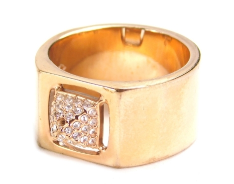 A Swarovski crystal ring, with pierced pyramid setting, on plain shank, size Q. (boxed)