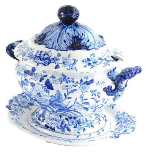 A 19thC Dresden Opaque China tureen cover and stand, in blue and white heavily decorated with flowers, marked beneath, the tureen 30cm high.