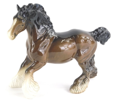 A Beswick pottery shire horse, in brown, black and white colour way, marked beneath, 20cm high.