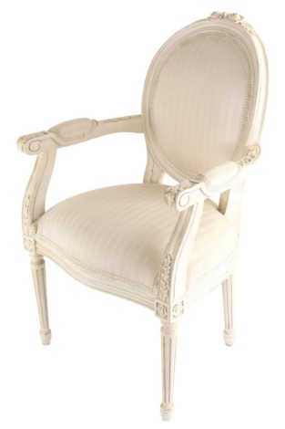 A child's or doll's French style open armchair, with floral rosettes and acanthus leaves on circular tapering reeded legs, 57cm high.