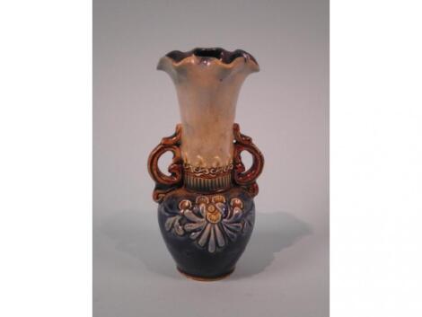 A Doulton Lambeth ware two handled vase with a shaped rim