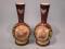 A pair of Victorian opaque glass vases each printed and painted with an