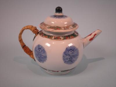 An early 19thC Chinese famille vert teapot and cover