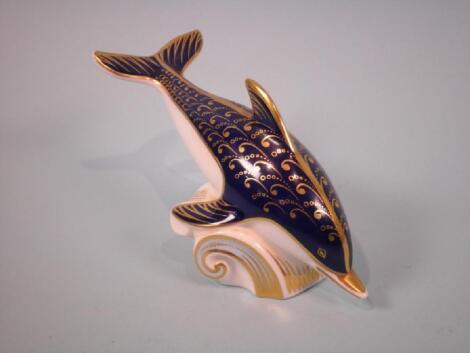 A Royal Crown Derby porcelain figure of a dolphin