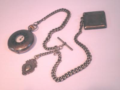 A continental silver half hunter pocket watch with engine turned decoration