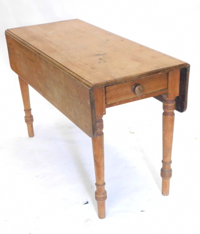 A Victorian mahogany Pembroke table, the rectangular drop leaf top with rounded corners, with a frieze drawer on turned tapering legs, 122cm long.