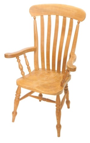 A grandfather chair. with lath back, on turned legs.