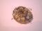 An early 20thC ornate floral brooch with central citrine faceted stone