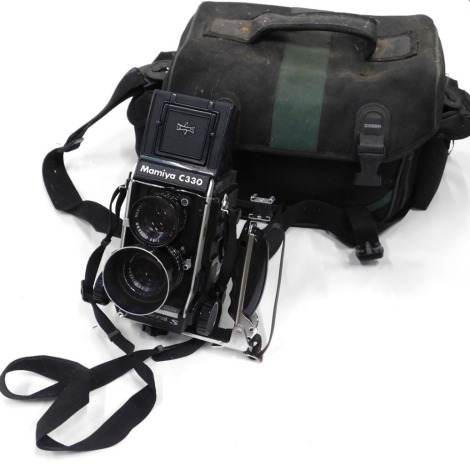 A Mamiya C330 twin-lens reflex camera, case, etc.