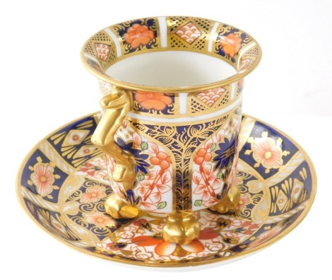 A Royal Crown Derby Imari pattern two handled cup, number 1128 and associated saucer 2451, printed marks beneath, 14cm dia. (2)