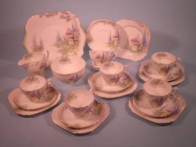 A Shelley porcelain tea service printed and painted with a garden urn and flowers