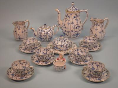 A German porcelain part tea service decorated in underglaze blue with a