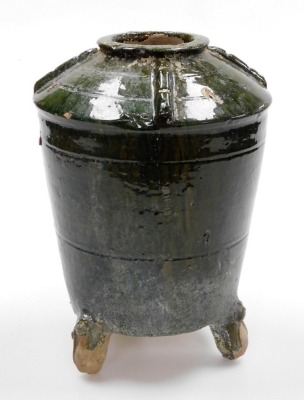 An Eastern Han style green glazed earthenware granary jar, of tapered shouldered design, raised on three feet, 31cm high. - 2