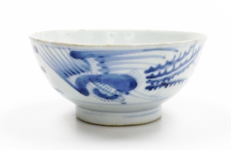 A 19thC Chinese provincial bowl, decorated in underglaze blue with a phoenix, 13.5cm diameter.