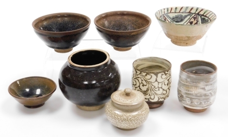 A collection of modern Oriental stoneware ceramics, including a pair of bowls, 12cm diameter, a squat spherical vase, 10cm high, small jar and cover, etc., (8).