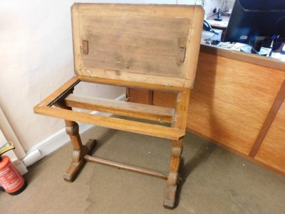 A Victorian oak architect's or library reading table, with lift top, that would rest on supports (AF), on a ratchet rise and fall mechanism, on chamfered supports with stretcher, 75cm minimum height, 92cm wide, 54cm deep. Please note this lot is located - 5