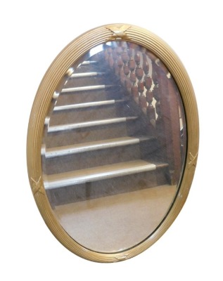 WIthdrawn pre sale. A Victorian oval gilt wall mirror, with reeded and ribbon crossed frame and bevel plate, 82cm x 54cm. Belongs to a member of staff. Please note this lot is located on site at the former offices of Messrs Stapleton & Son Solicitors, 1 - 2