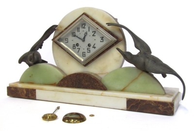 A French Art Deco onyx mantel clock, with diamond shaped silvered clock face and blue hands, flanked by applied metal birds, 29cm high, 50cm wide, 13cm deep. (AF)