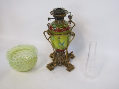 A Victorian pottery oil lamp, the green vaseline glass flared shade, a chimney on a ceramic Doulton Art Nouveau style body, with Gothic brass mounts, 65cm high. - 2