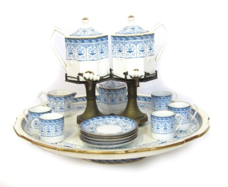 A Wedgwood Tete-a-Tete tea service, with a large rotating blue and white platter, five cups and saucers, milk jug and sugar bowl, with two tea urns on applied brass stand, 42cm high, 50cm diameter.