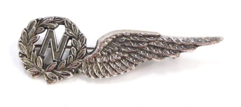 An Elizabeth II silver navigator wing brooch, the wreath with central N emblem and single wing, Birmingham 1952, 5.5cm wide, 7.3g all in.