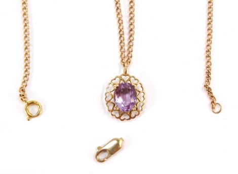 A 9ct gold amethyst pendant and chain, the oval pendant with heart shaped outer border and oval cut amethyst in four claw setting, on a fine link chain, 40cm long, 5.8g all in, with additional clasp.