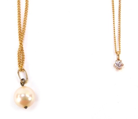 Two 9ct gold pendants and chains, comprising a cultured pearl drop pendant on fine link chain, 44cm long, and a further diamond set pendant with diamond approximately 0.02ct, on a 44cm long fine link chain, 4.3g all in.