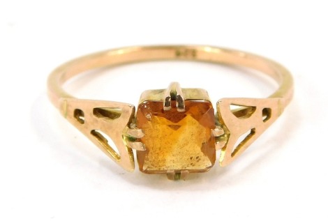 A 9ct gold citrine dress ring, with ascher cut citrine in double four claw setting, on pierced fan design shoulders on a thing plain rose gold band, size O, 1.5g all in.