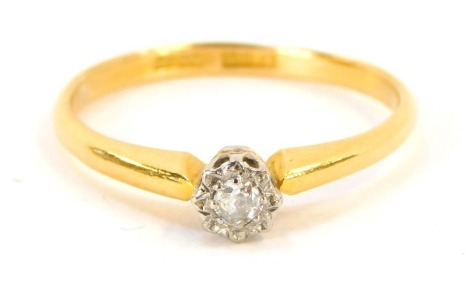 A 22ct gold diamond solitaire ring, the illusion set round brilliant cut diamond in a platinum setting, approximately 0.05points, on a yellow metal band stamped 22ct, ring size P½, 2.7g all in.