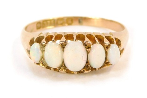 A 9ct gold opal dress ring, with five oval opals, in claw setting, ring size N½, 2.9g all in.