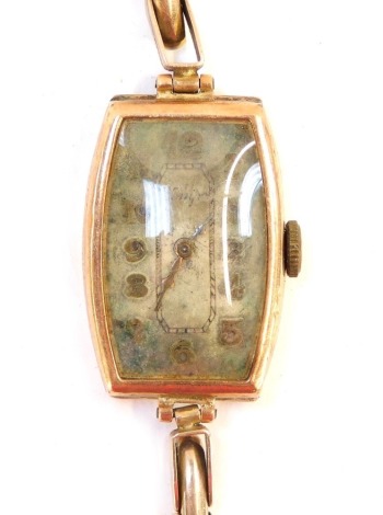 A 9ct gold ladies wristwatch, with a shaped rectangular dial on an expanding 9ct gold strap, 15g all in. (AF)