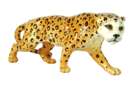 A Beswick leopard, on the prowl, with black Beswick England, stamped to underside, 30cm wide.