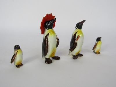 Four Beswick penguins, comprising one with parasol, adult penguin and two children, tallest 11cm high. - 2