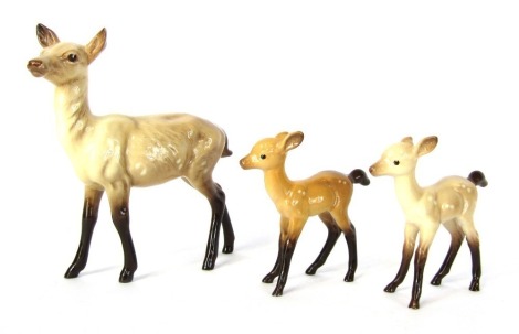 Three Beswick deer ornaments, to include a doe and two fawns, 15cm and 9cm high respectively.