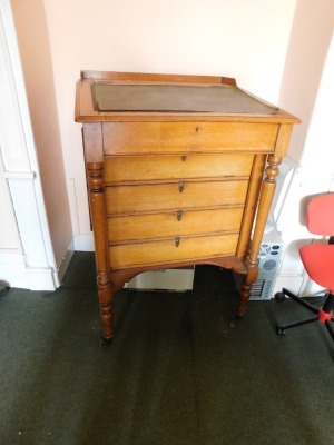 A Victorian oak clerk's desk, with galleried top with slope revealing desk top with the retailer's label for George Spademan, Cabinet Maker and Upholsterer, Stamford., over four fall flap drawer fronts, with Wellington locking action, opening to reveal pi - 3