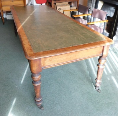 A Victorian mahogany library table, with tooled leather top, moulded frieze, turned legs and brass castors, 75cm high, 95cm wide, 245cm long. Please note this lot is located on site at the former offices of Messrs Stapleton & Son Solicitors, 1 Broad Stre