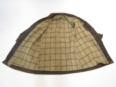 An early 20thC vintage gentleman's driving leather overcoat, with chequered lined interior. - 2