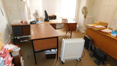Furnishings of room, being three sapele desks, steel four drawer filing cabinet, oak kneehole desk, table, oil filled electric radiator, fan, and chairs. (a quantity) Please note this lot is located on site at the former offices of Messrs Stapleton & Son
