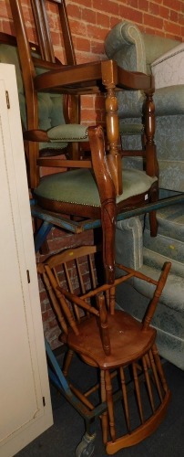 A pair of spindle back kitchen chairs, together with a button back chair and a dining chair. (4) The upholstery in this lot does not comply with the 1988 (Fire & Fire Furnishing) Regulations, unless sold to a known exporter or upholsterer it will be cut f