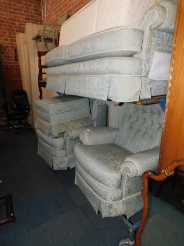 A four piece suite, upholstered in green brocade fabric. The upholstery in this lot does not comply with the 1988 (Fire & Fire Furnishing) Regulations, unless sold to a known exporter or upholsterer it will be cut from the frame before leaving the premise