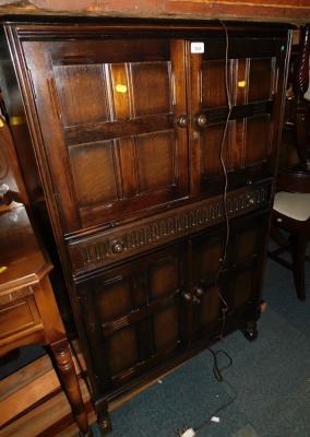 A stained oak cocktail cabinet, with single drawers and lower cupboard.WARNING! This lot contains untested or unsafe electrical items.  It is supplied for scrap or re-conditioning only. TRADE ONLY 