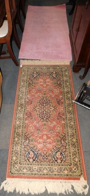 A pink rug, together with a Prado Orient Keshan rug. (2)