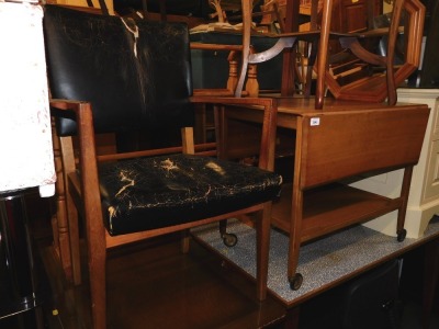 A teak and black leather Gordon Russell carver chair, together with a tea trolley. (2)